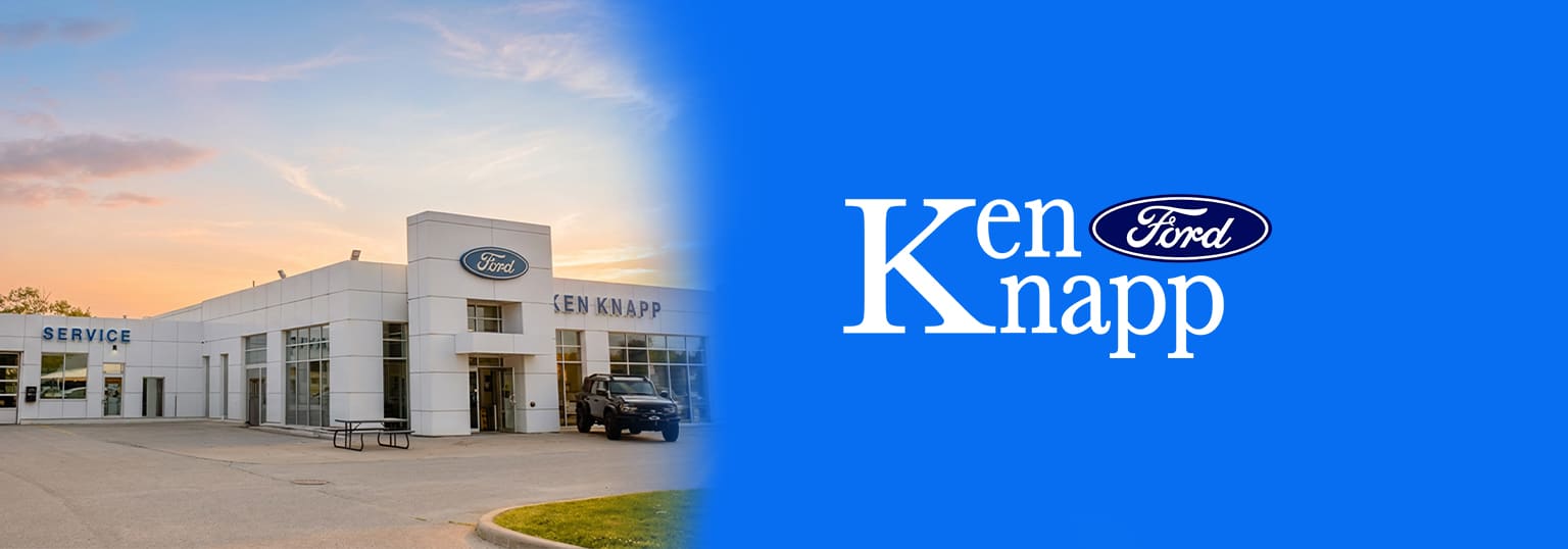 Ken Knapp Ford dealership exterior at sunset with logo and service entrance.