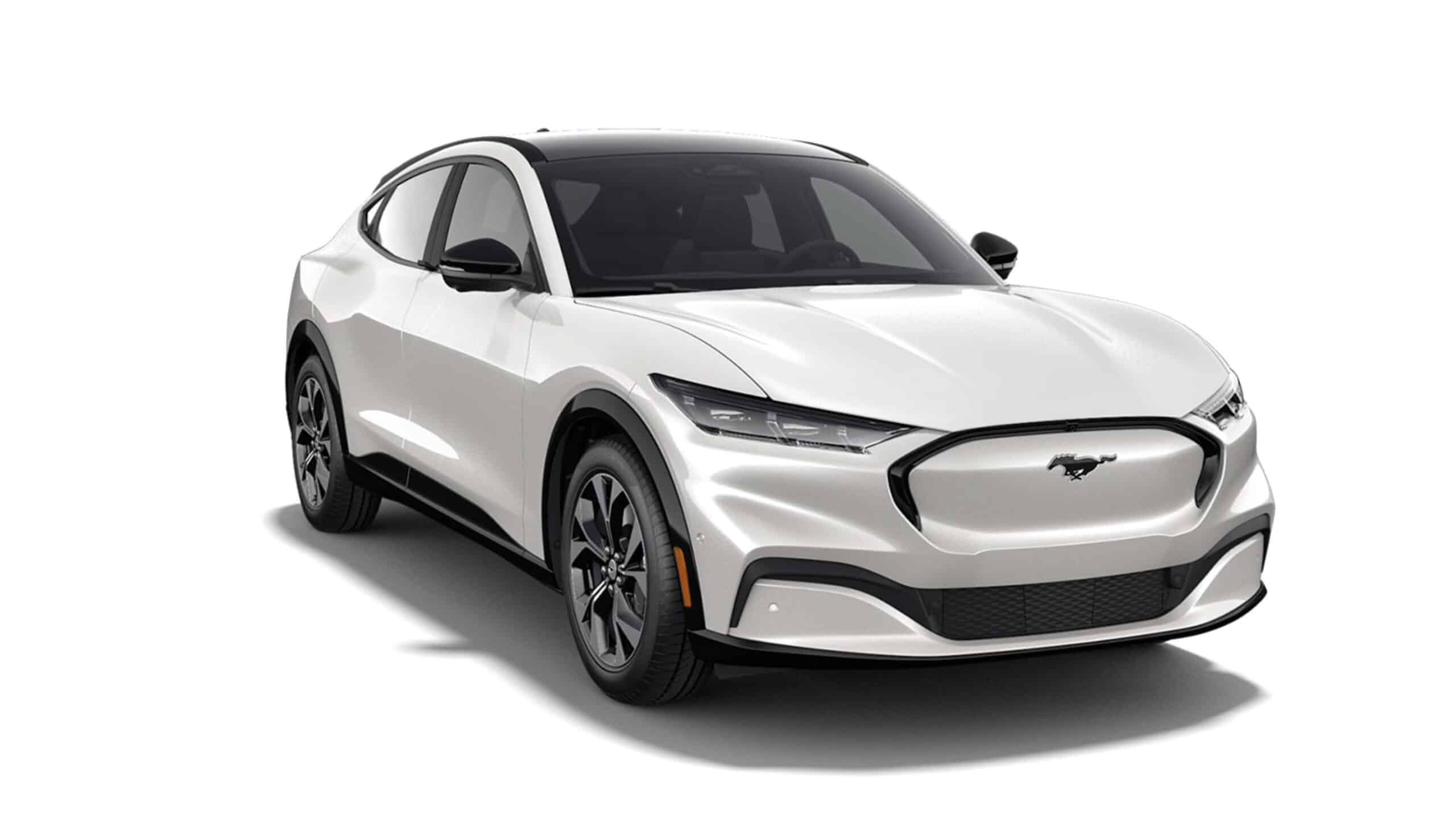 White electric SUV with sleek design and emblem on the front grille, viewed in studio light.